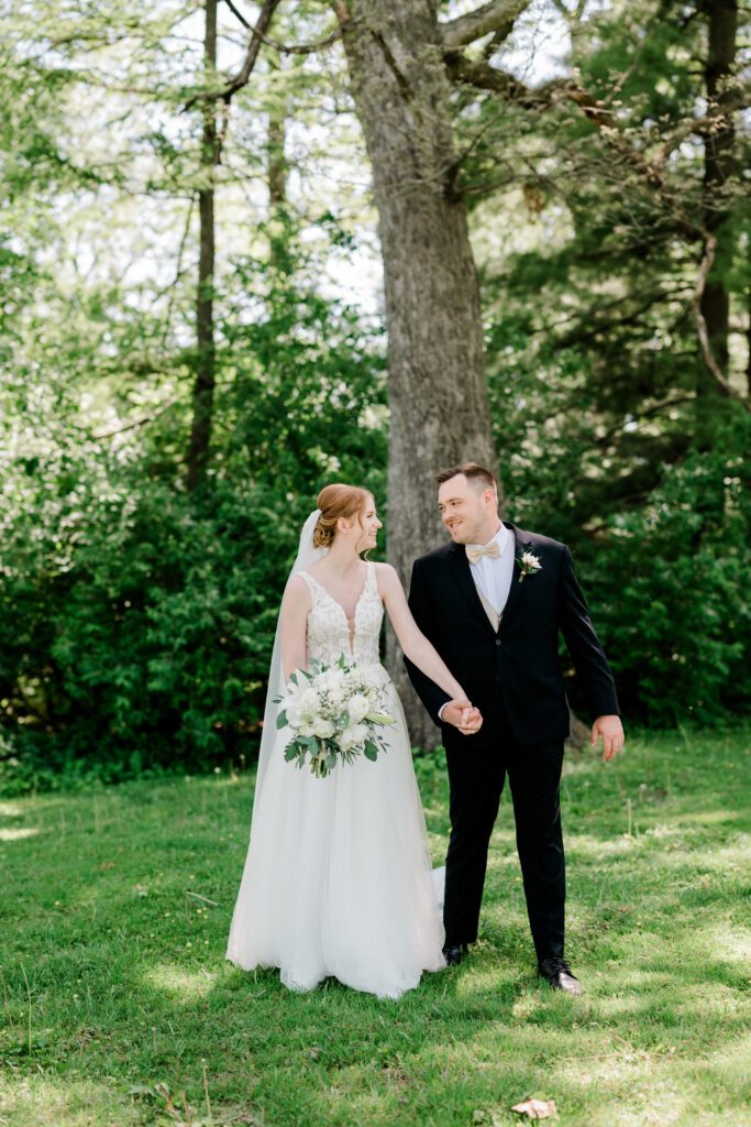 Bride and groom summer first look on the grounds at Fishermen's Inn.