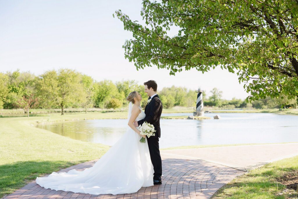 Bride and groom portrait by water at Fishermen’s Inn