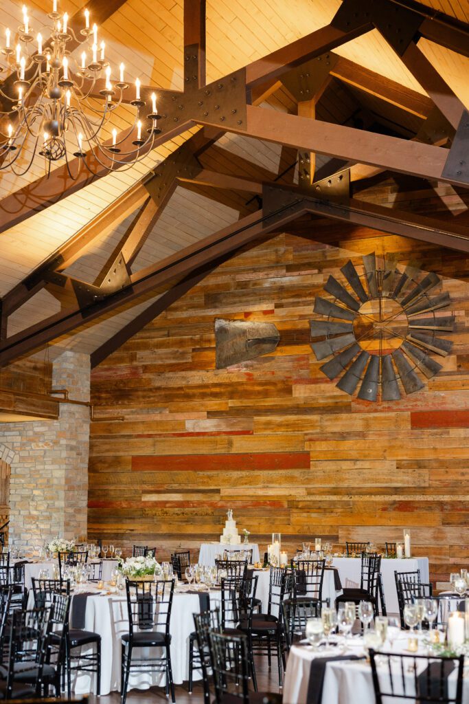 Reception space at Fishermen’s Inn with wood beams and chandelier