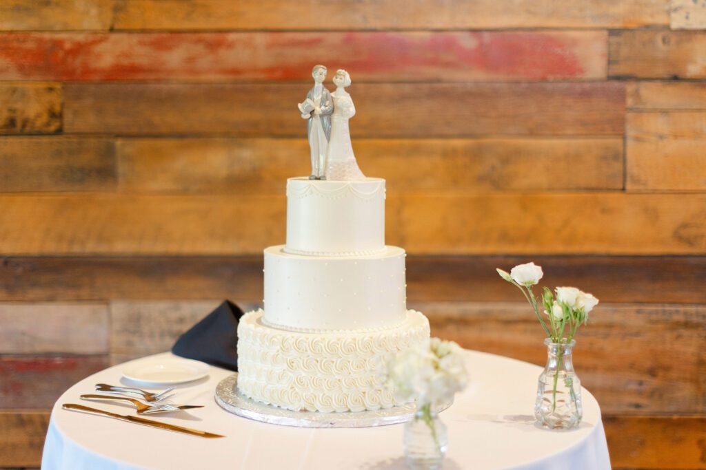 Elegant wedding cake with vintage couple topper