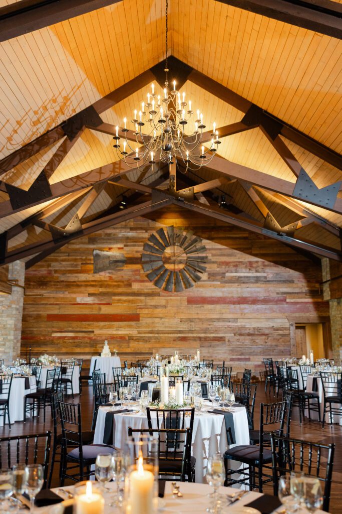 Reception space at Fishermen’s Inn with wood beams and chandelier