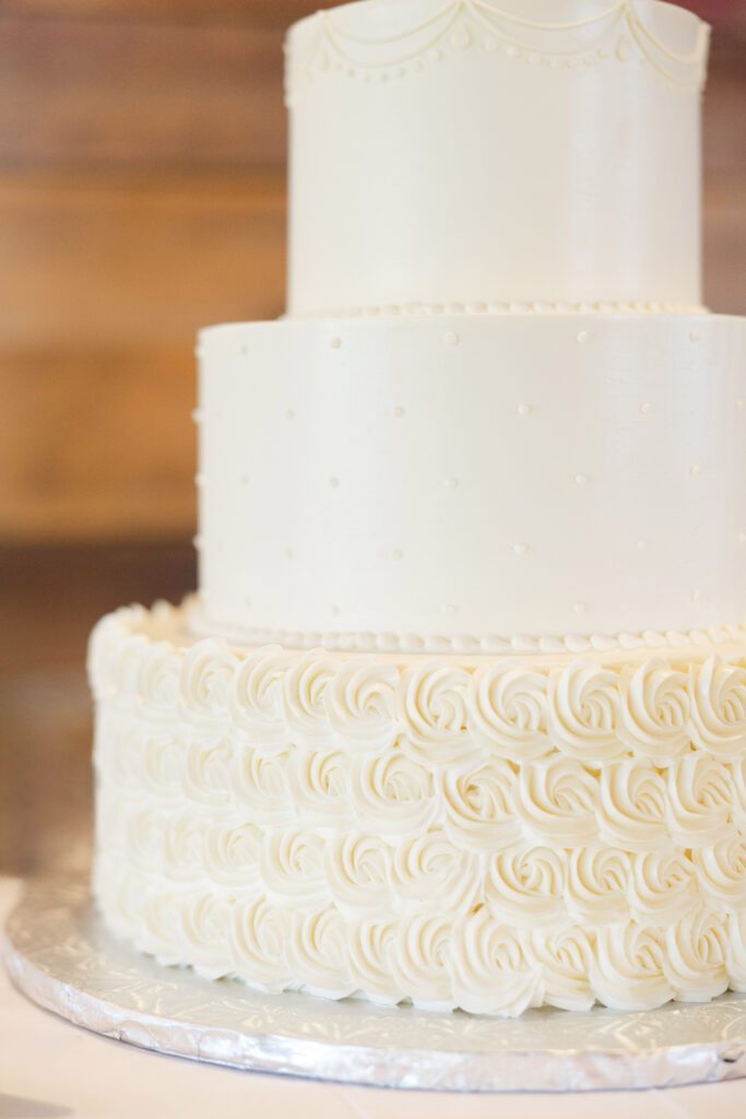 Elegant white three-tier wedding cake