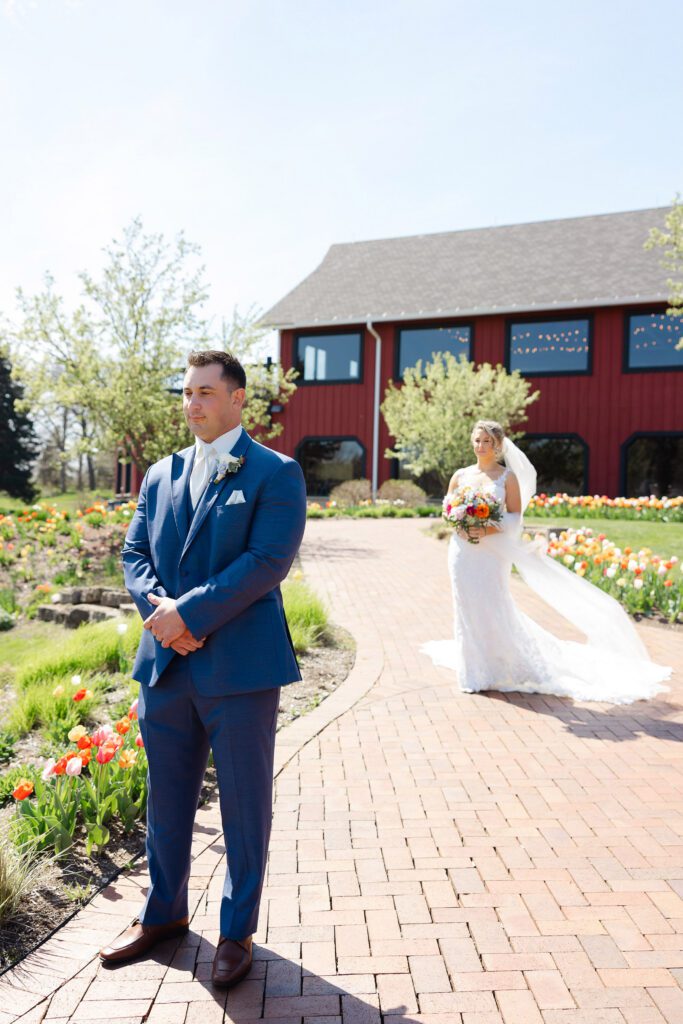 first look moment outdoors at spring wedding at Fishermen’s Inn