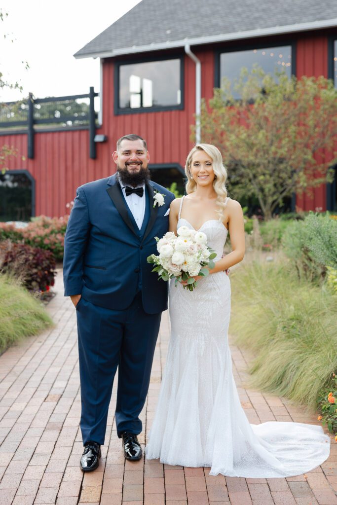Linda and Ricky standing together on their August wedding day at Fishermen’s Inn