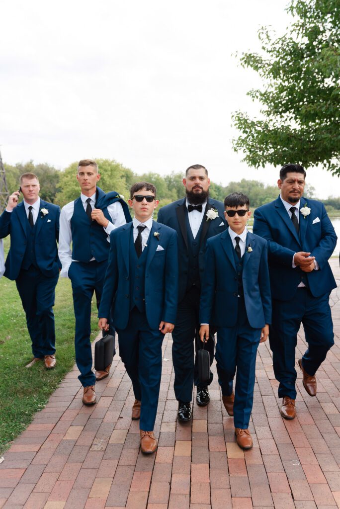 Ricky and his groomsmen posing together during the wedding day at Fishermen’s Inn